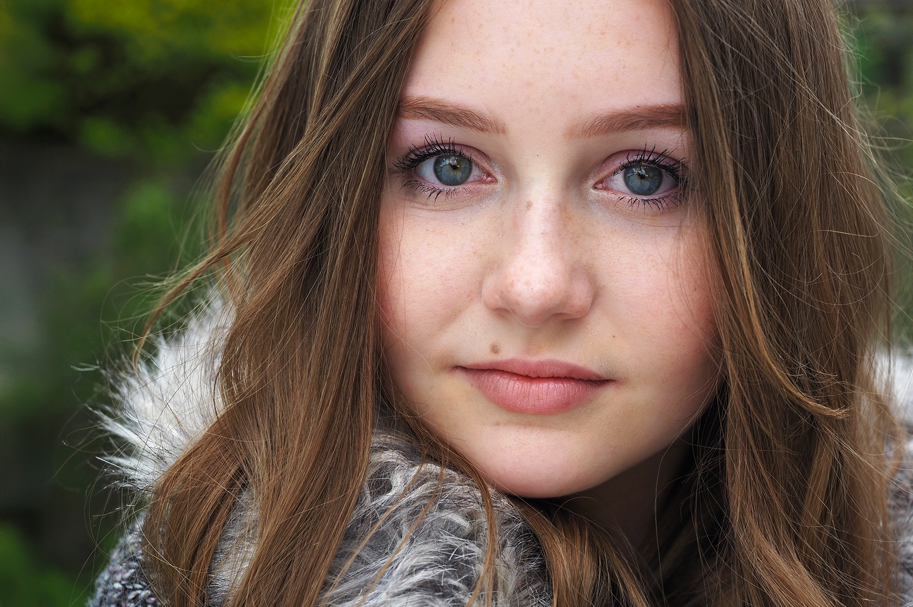 Lifestyle portrait of a teenager in garden