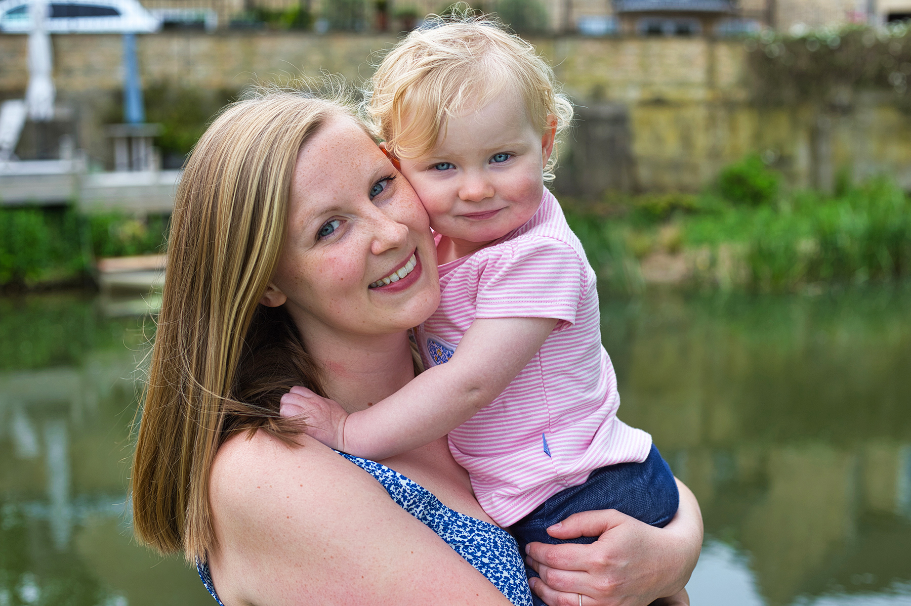 Location portrait of young girl and mother in park