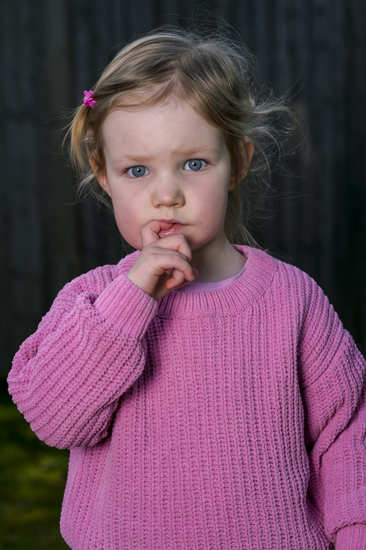 Lifestyle portrait of young girl in garden