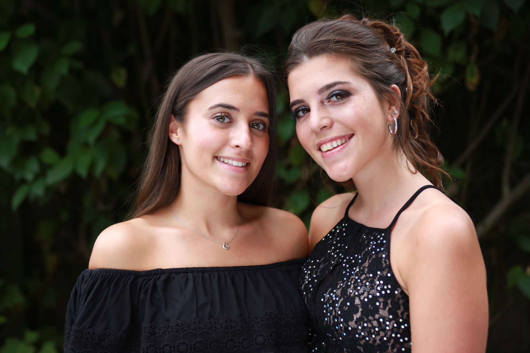 Portrait of sisters on Prom Day