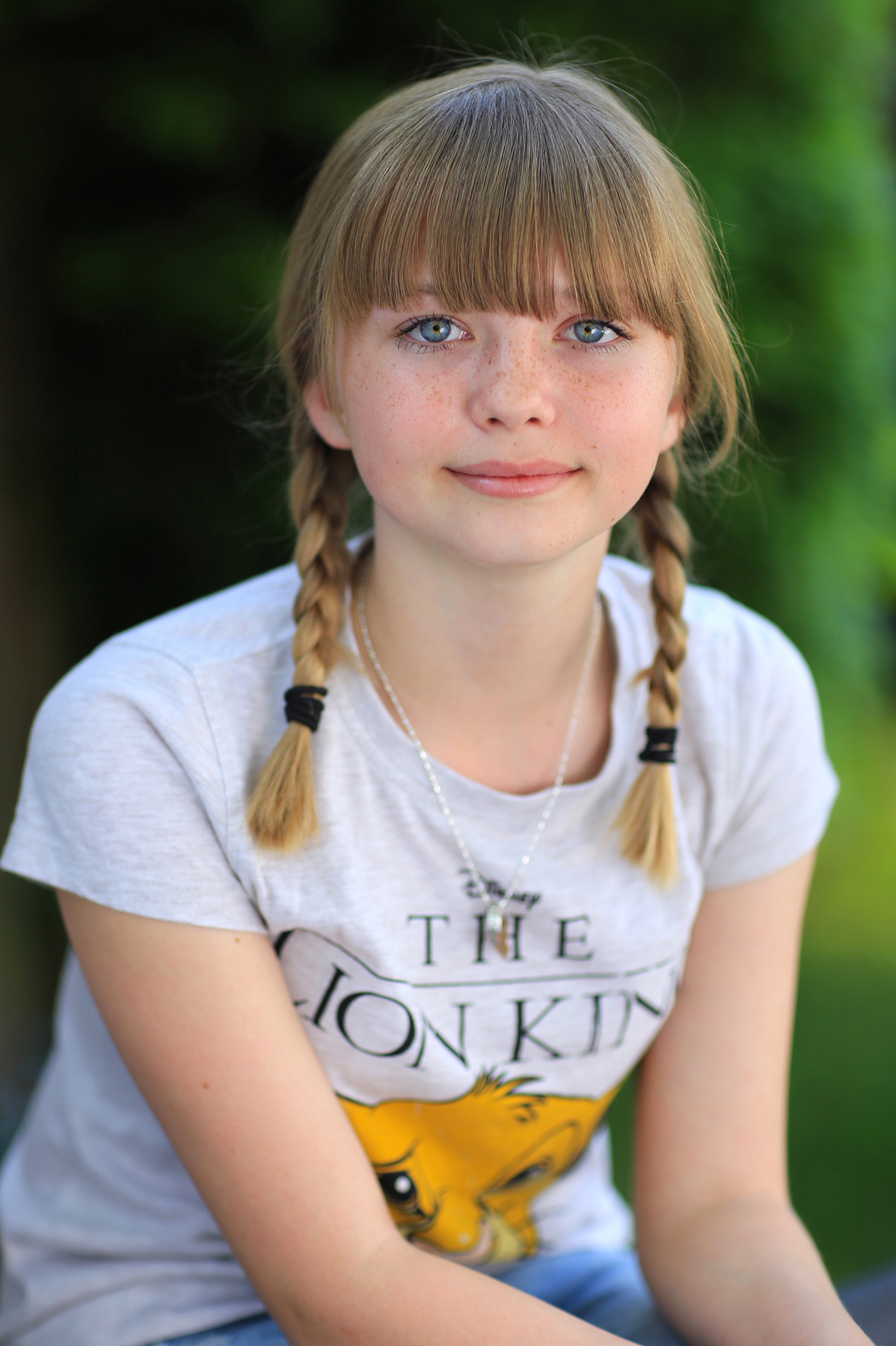 On location: Daylight portrait of teenager in garden
