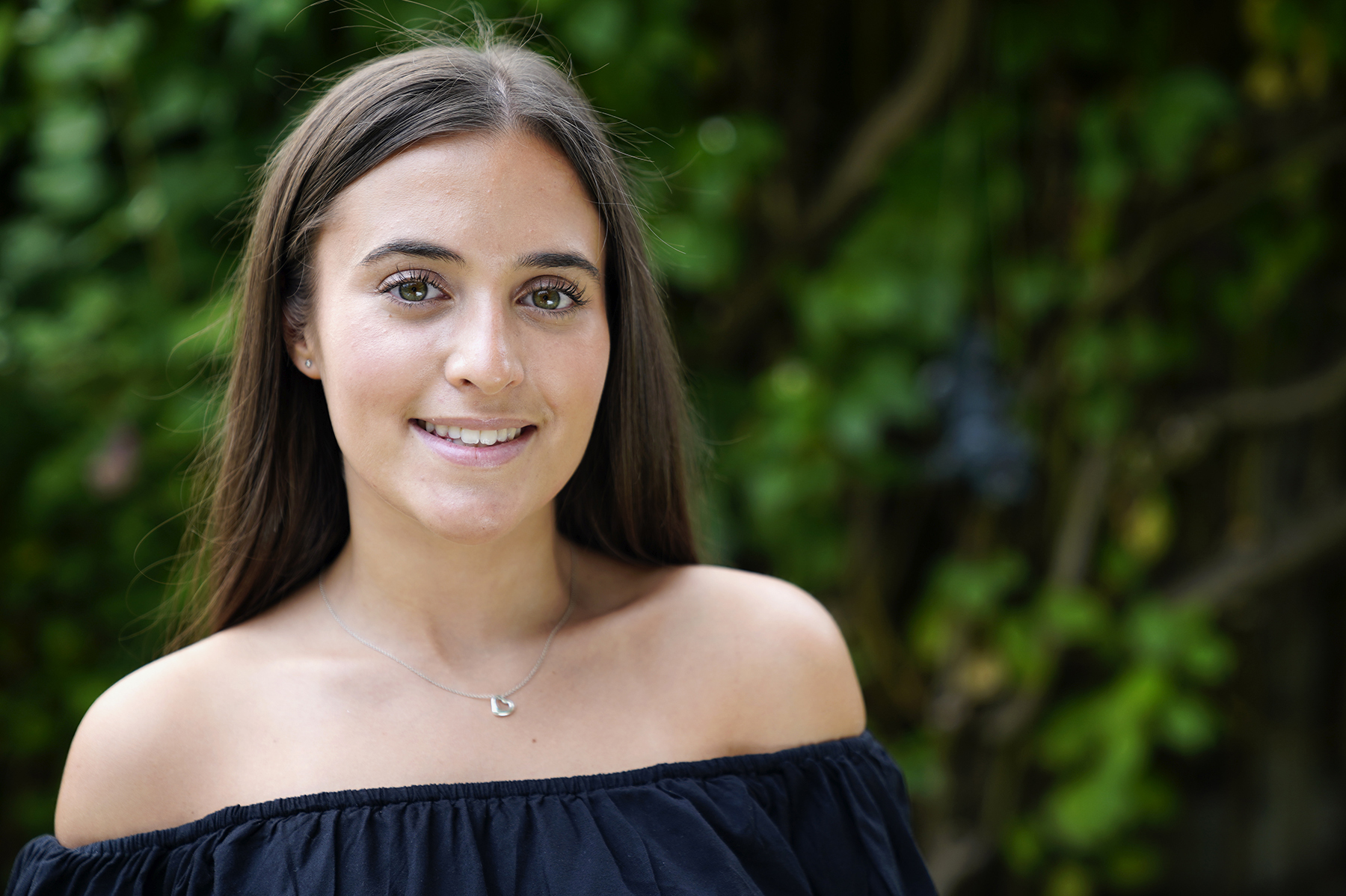 Lifestyle portrait of a teenager in garden