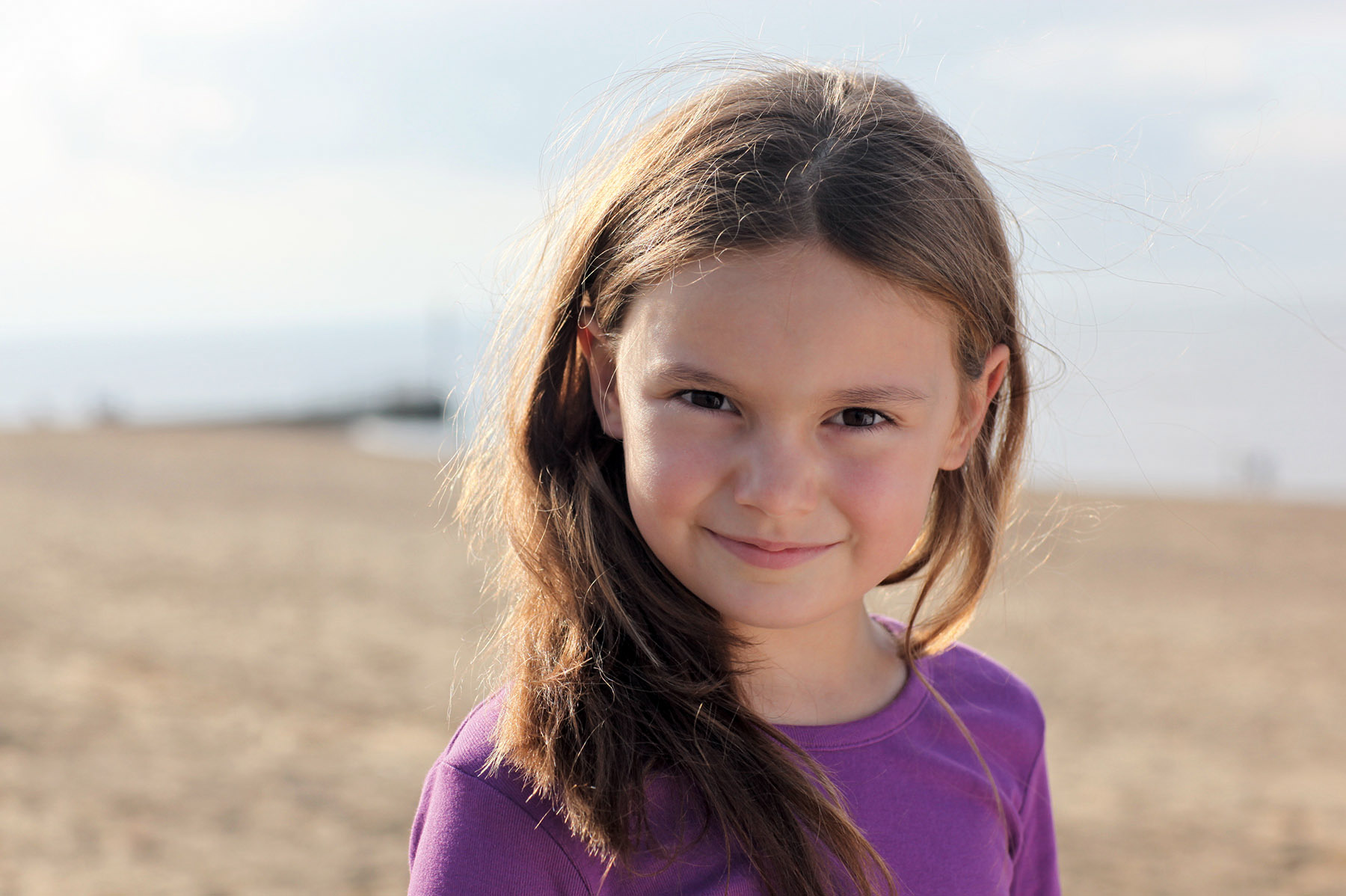 Location portrait of young girl on beach